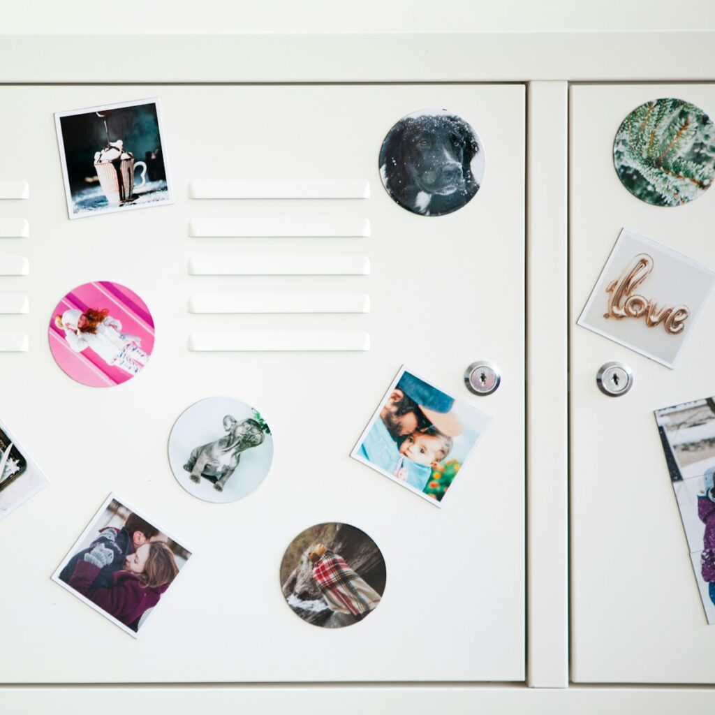 a white refrigerator with magnets and pictures on it